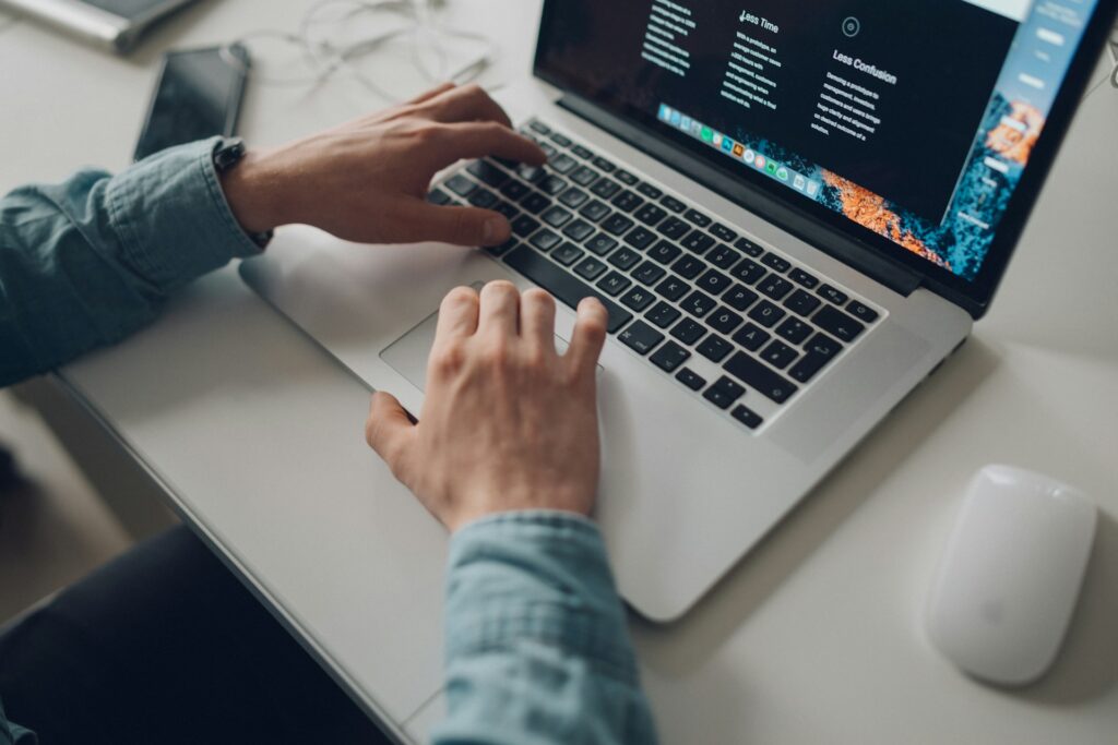 Person in laptop for Beyond the Obvious Whitepaper